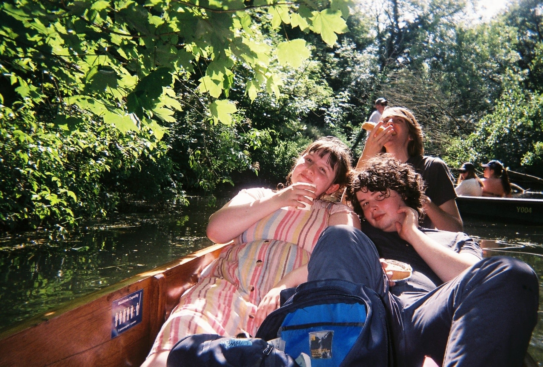 Finn, Rhianna, and their friend Tom on a punt